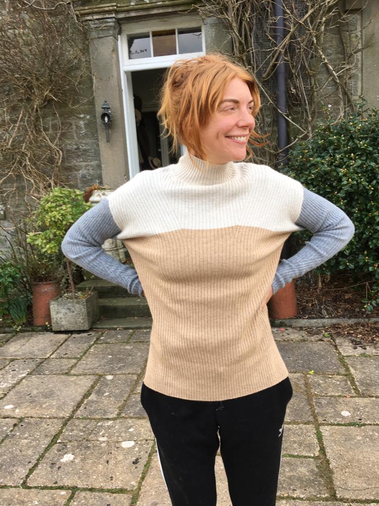 A ribbed turtle-neck in cream, camel and grey, Size M/L